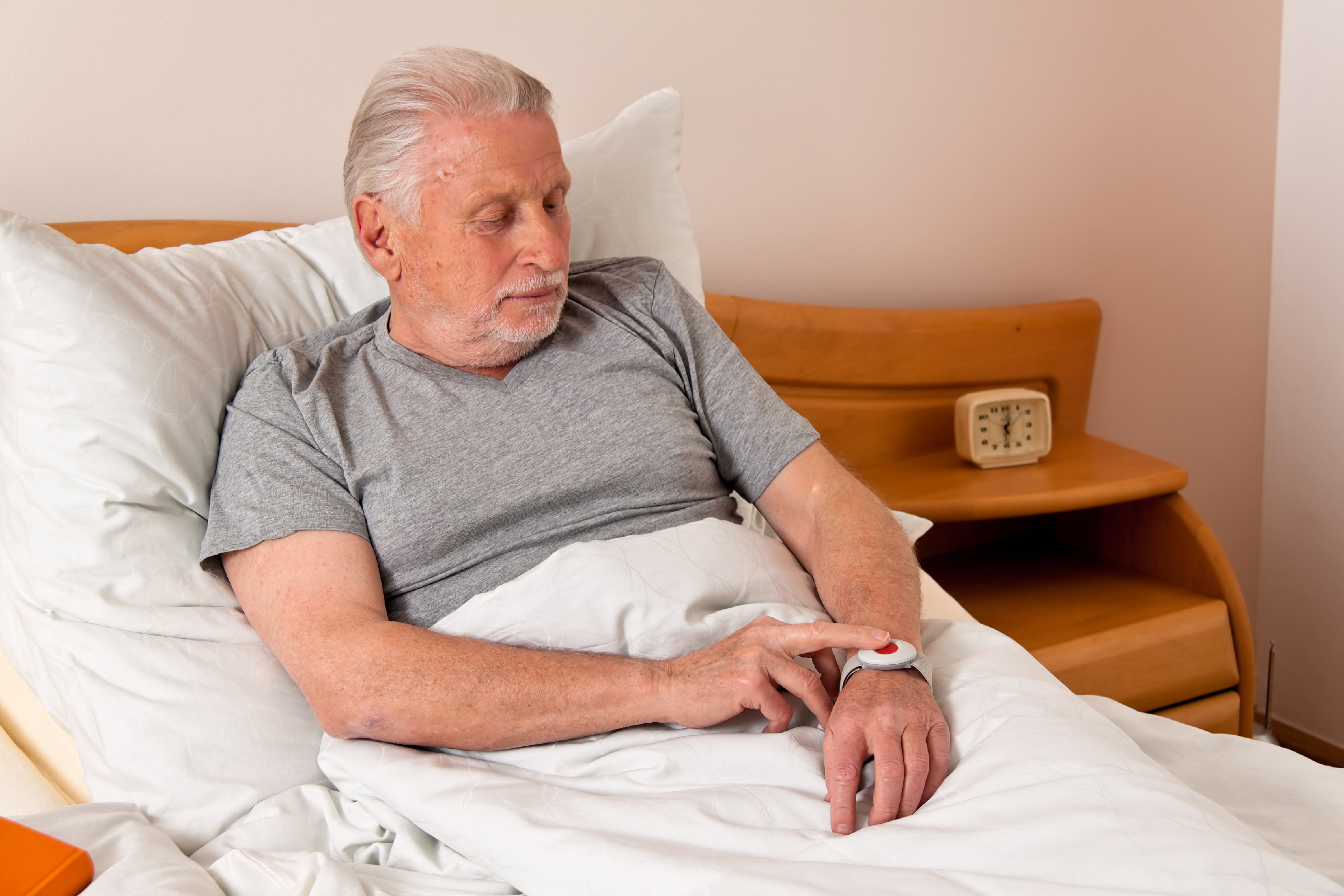 rufhilfe with a senior emergency phone in bed